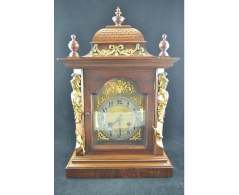 A 19th century German walnut cased bracket clock with gilt metal mounts and eight day movement, complete with bracket - clock