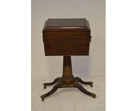 An early 19th century brass inlaid rosewood teapoy, anthemion and floral decoration to top, fitted interior containing four t