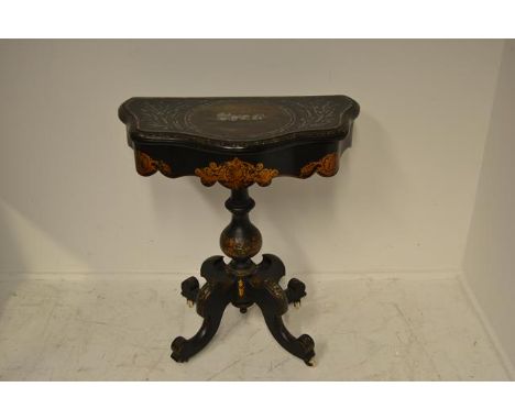 A 19th century papier mache mother of pearl inlaid card table, centre column with four scroll legs and white porcelain caster