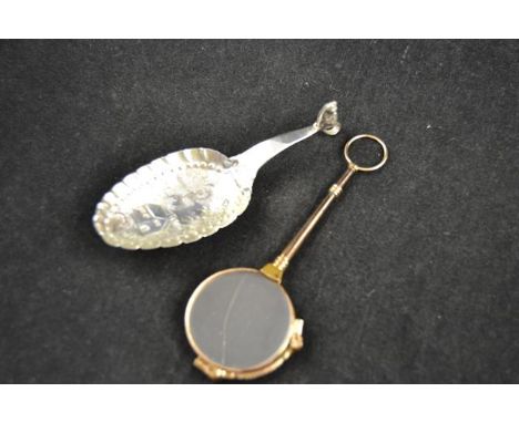 A continental silver embossed caddy spoon with fox surmount to handle, together with a gilt metal framed lorgnette (one lens 