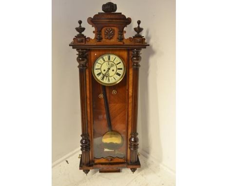 A 19th century walnut cased Vienna regulator clock, white enamel dial with subsidiary seconds dial, brass bob pendulum, centr