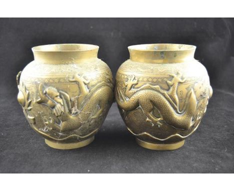 A pair of Chinese brass bulbous vases with dragons in relief chasing flaming pearl, mark to base - H13cmCONDITION REPORTdrago