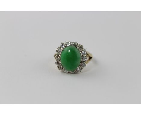 ***CLIENT REQUESTED RETURNED TO TEDDINGTON 6/1/18 JM 1/11/18***&nbsp;A 9ct. gold, jade and diamond dress ring, four claw set 