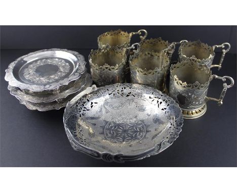 An Islamic white metal niello swing handle basket, having pierced rim with niello floral swags and floral panels to engine tu