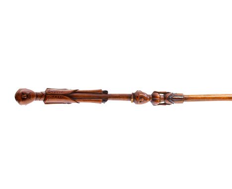 An African Tribal walking stick, possibly Nguni/Tsonga, Southern Africa, 19th century, carved with a gentleman wearing a floc