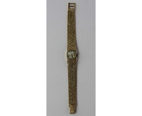 A Rotary 9ct. gold ladies' bracelet watch, manual movement, having circular silvered dial with gilt raised baton hour markers