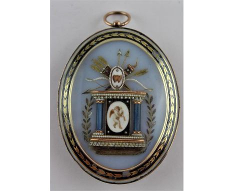 A fine and large Georgian mourning pendant, of oval from, with engraved yellow metal frame, the front having a gold and seed 