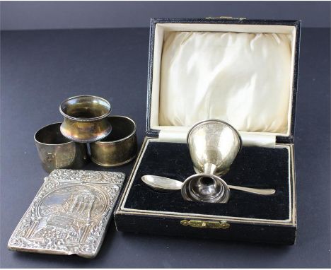 A boxed christening silver egg cup and spoon set, by Barker Brothers Silver Ltd, Birmingham 1928/9, the cup engraved "Martin"