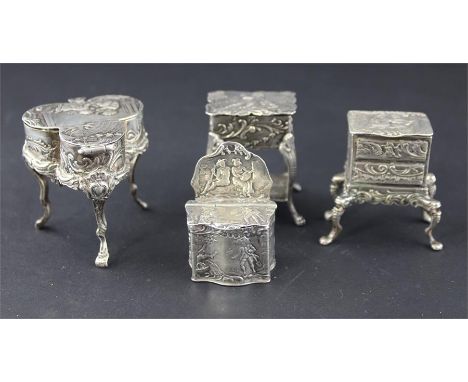 Four late 19th century Dutch silver miniature boxes fashioned as pieces of furniture, to include a commode, dressing table, c