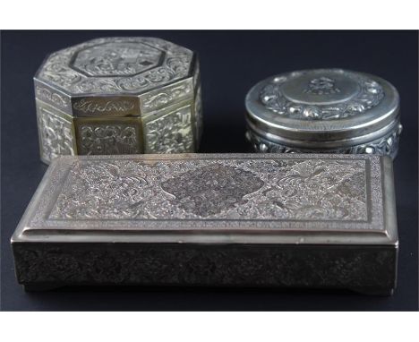 An Islamic white metal rectangular box,&nbsp;having hinged lid repousse central arabesque panel surrounded birds amidst folia