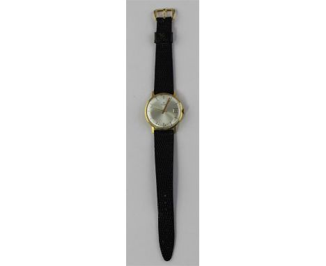 An Onsa 18ct. gold gentleman's wrist watch, manual movement, having circular silvered dial with gold raised baton hour marker
