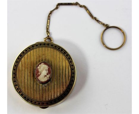 An Art Deco Tiffany &amp; Co 14ct. gold and nielo work compact, of circular form, having engine turned linear decoration to b