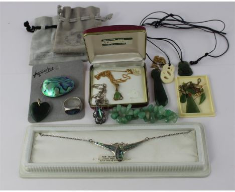 A collection of New Zealand jade and Paua shell jewellery, to include; a green nephrite jade pendant within yellow metal moun