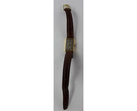 A J W Benson 18ct. gold ladies' wrist watch, manual movement, having rectangular Arabic numeral dial, case back impressed "18