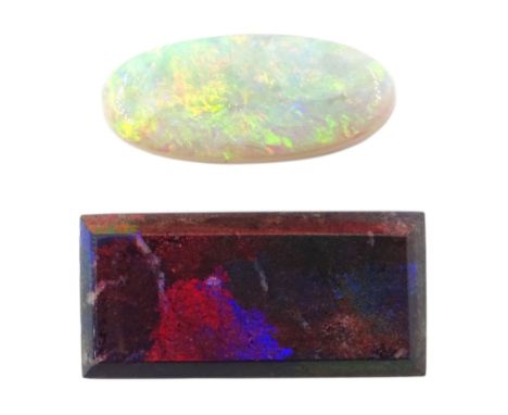 Loose rectangular black opal and a loose oval cabochon opal (2)Notes: By direct decent from Barraclough family