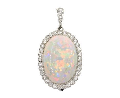 Early-mid 20th century platinum opal and diamond cluster pendant/brooch, the oval cabochon opal in a surround of old cut diam