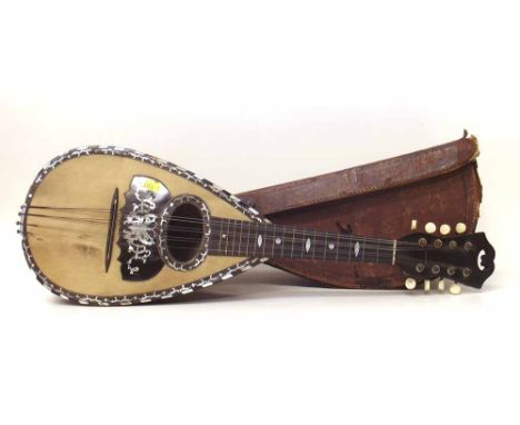 F. Ferrari and Son Neoplitan Bowl Back Mandolin with fluted multi rib back and pearl with case. Condition report: see terms a