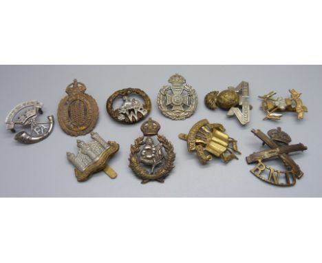 Ten military regimental cap badges, including 9th and 12th Lancers, Queen's Own Worcestershire Hussars, Lancashire Fusiliers 