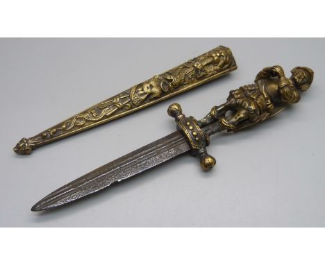 A European brass dagger and scabbard with figural handle, overall length 26cm 