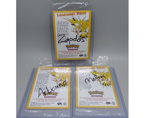 Three sealed vintage Pokemon cards, Moltres, Zapdos, Articuno 