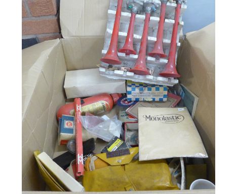 A box of vintage motor car items including 1970s air horn set, Carello spotlight, Osram bulbs and packets, oil can, etc. 