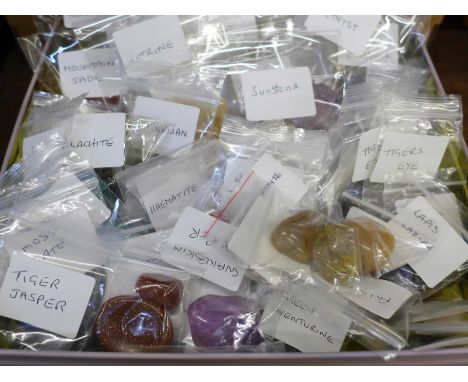 A collection of mineral samples; amethyst, amazonite, citrine, smoky quartz, kyanite, etc., and a collection of tumbled cryst