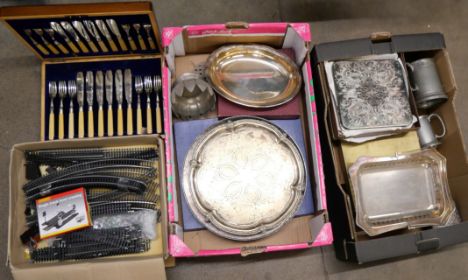 A box of Pendragon silver plated table mats, four boxes plus six loose coasters, a cased set of twelve fish knives and forks 