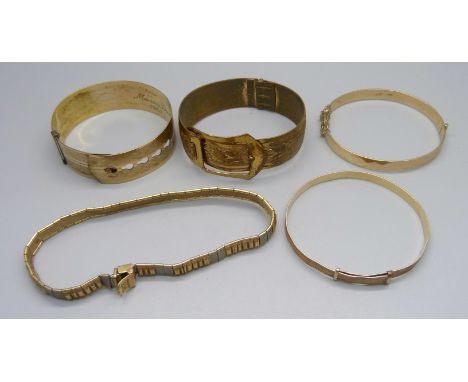 Three rolled gold bangles, one other bangle and a bracelet 