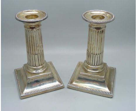 A pair of silver Corinthian column candlesticks, George Howson, Sheffield 1898, 13cm 