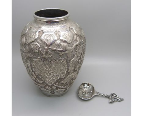 A Persian-Iranian white metal vase with bird detail, mark on the base, and a Herbertus Hooijkaas Dutch silver caddy spoon 