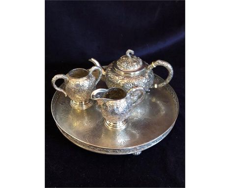 A Chinese silver tea set to include teapot, milk jug, sugar bowl and tray.