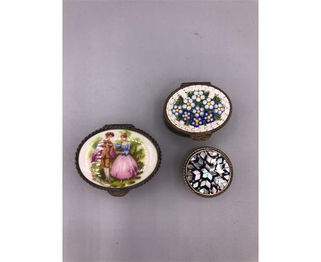 A Trio of white metal and enamel trinket boxes.