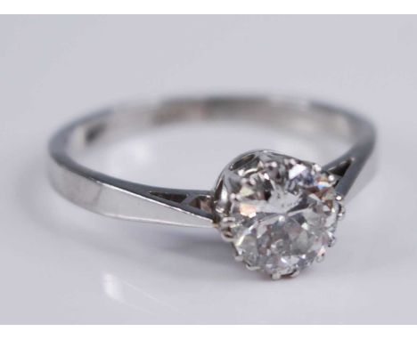 A white metal diamond solitaire ring, featuring a round brilliant cut diamond in a claw setting, diamond dimensions approx 6.