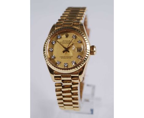 A lady's Rolex 18ct gold Oyster Perpetual datejust superlative chronometer officially certified wristwatch, having a signed a