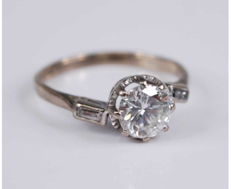 An 18ct gold diamond solitaire ring, the principle round brilliant cut diamond weighing approx 1.08 carats, claw mounted with