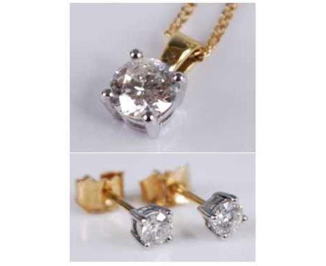 An 18ct yellow and white gold diamond pendant and earring set, the pendant featuring a round brilliant cut diamond in a four-