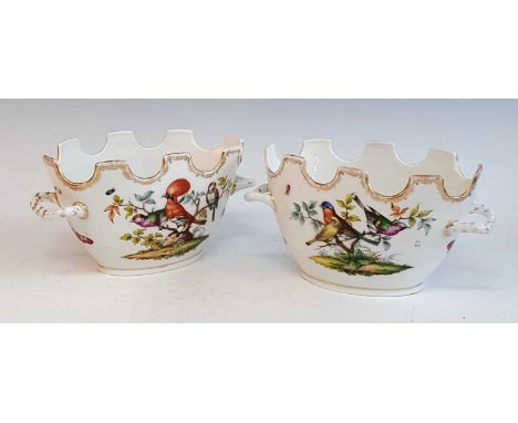 A pair of 19th century German porcelain bowls, each of oval form, having twin handles, enamel decorated with exotic birds and