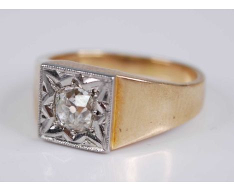 A gent's 18ct gold diamond solitaire ring, the old round cut in a carved white metal (probably platinum) 'gypsy' setting, wei