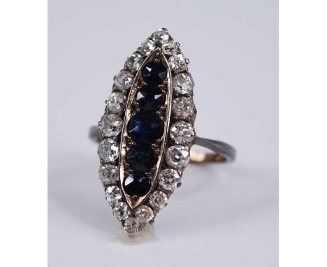 An Edwardian yellow metal, sapphire and diamond dress ring, the large elliptical setting measuring approx 28.5 x 13mm, pavé s