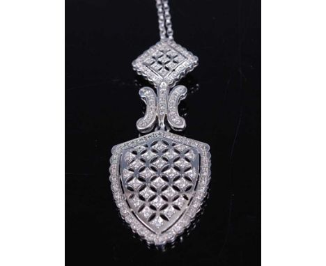 A white metal diamond articulated shield shaped pendant, having 106 melee cut diamonds grain set in lattice work sections, di