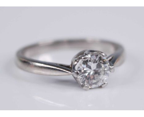 A contemporary white metal diamond solitaire ring, the six-claw set round brilliant cut weighing approx 0.75 carats, colour a