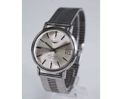 A gent's Longines Flagship automatic steel cased wristwatch, having a signed silvered dial with date aperture and baton marke