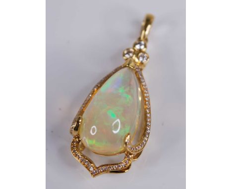 An 18ct gold Ethiopian opal set pendant, the large three-claw set cabochon opal weighing approx 8 carats, within a surround o