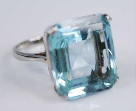 A white metal aquamarine single stone ring, having an emerald cut aquamarine in a four-claw setting, aquamarine dimensions ap