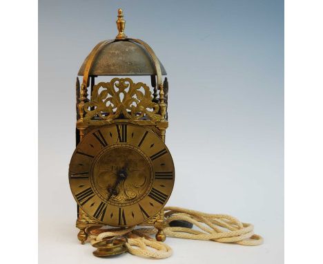 An 18th century brass lantern clock, the dial signed Rich(ard) Rayment Bury (St Edmunds), the pillared case with ball feet an