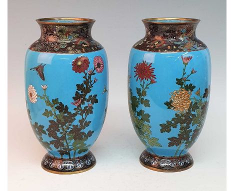 A pair of Japanese Meiji period cloisonne enamel vases, each of ovoid form, decorated with birds amongst chrysanthemums, h.33