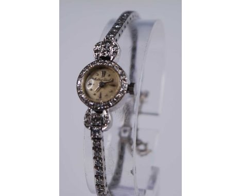 A lady's Mathey-Tissot 14ct white gold diamond set cocktail watch, having a signed champagne dial with dot markers, manual wi