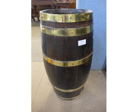 A brass bound oak barrel stick stand 