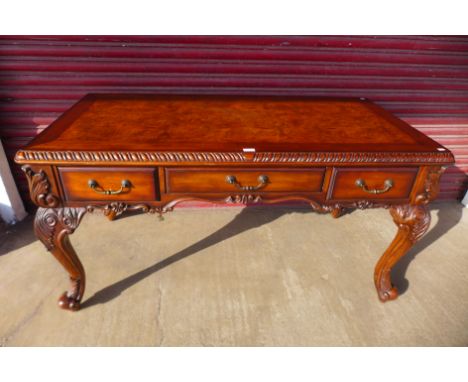 A Chippendale style hardwood three drawer library desk 