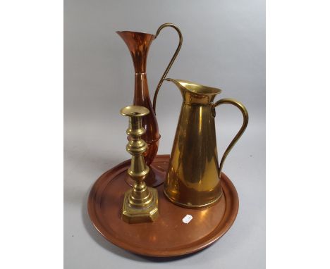 A Copper Circular Drinks Tray, Copper Jug, Brass Jug and Brass Candlestick 